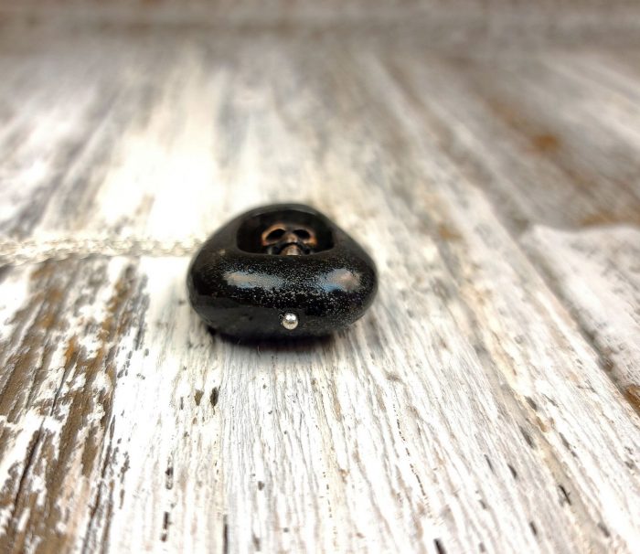 River Rock with Bronze Skull